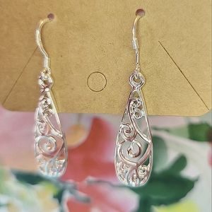Silver teardrop patterned earrings